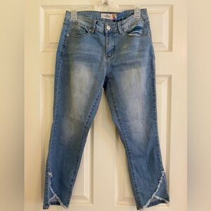 Mid Rise Blue Jeans with criss cross details at the bottom